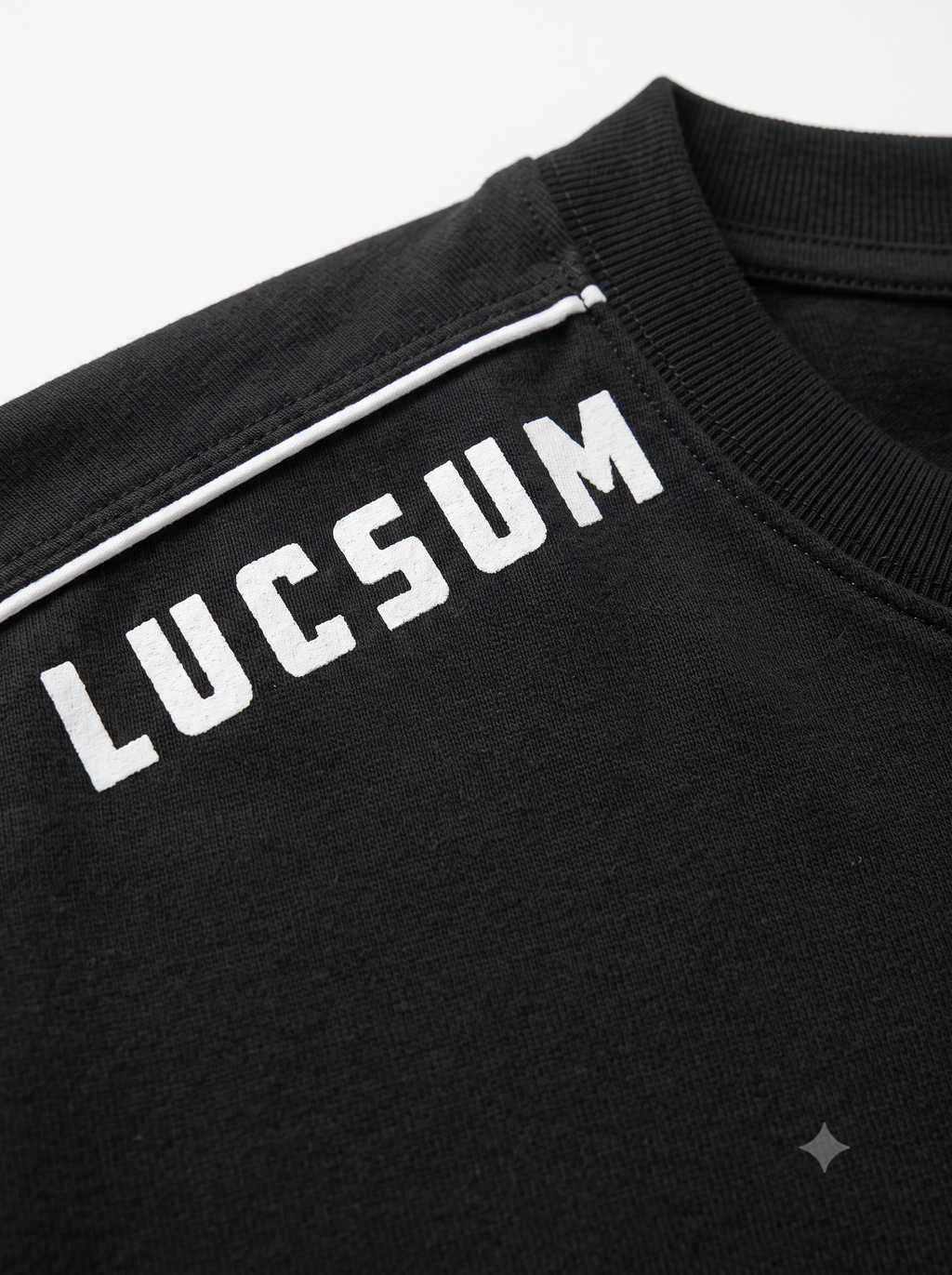 Lucsum Shoulder Logo Black — Macro close-up