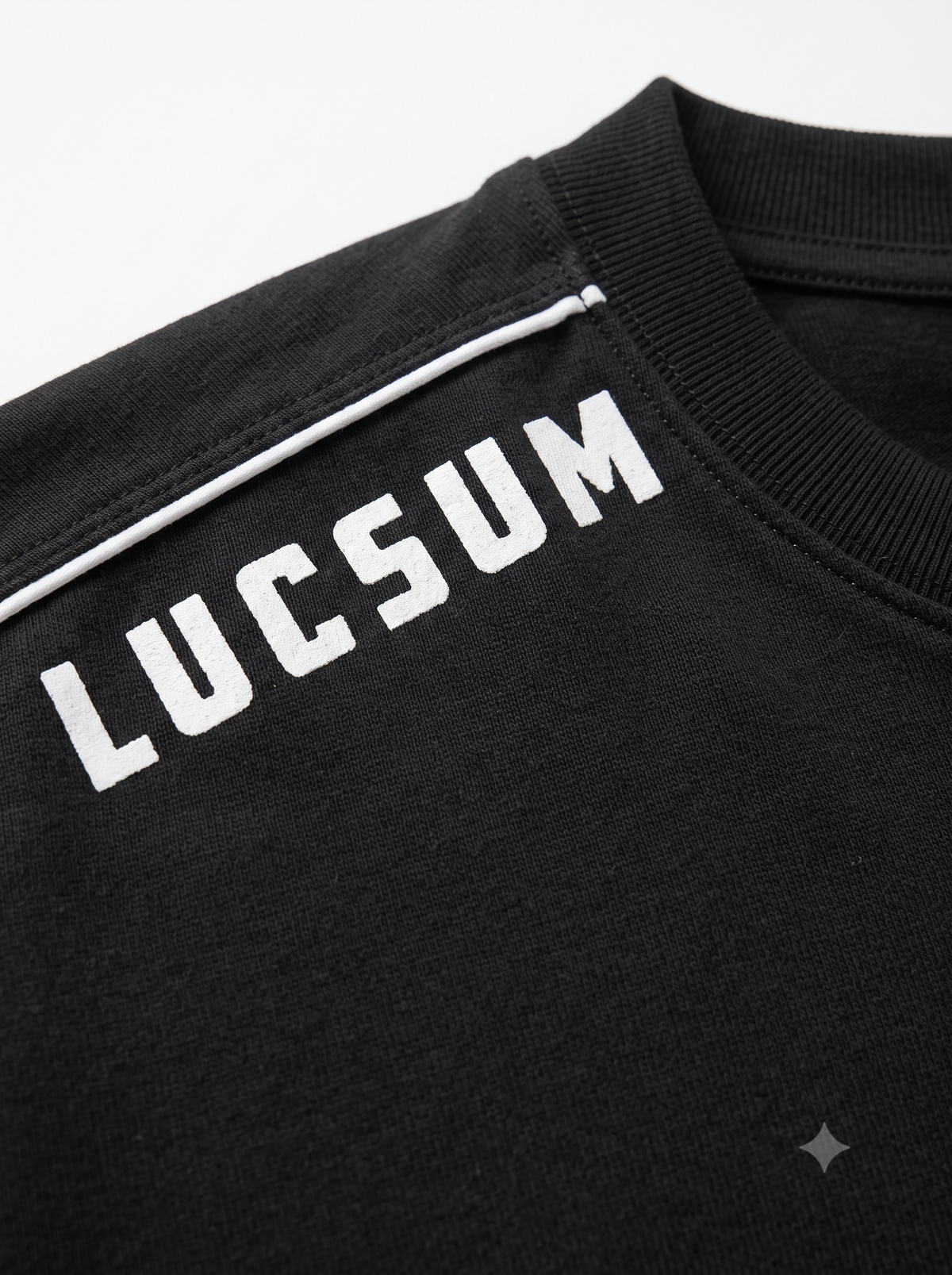 Lucsum Shoulder Logo Black — Macro close-up