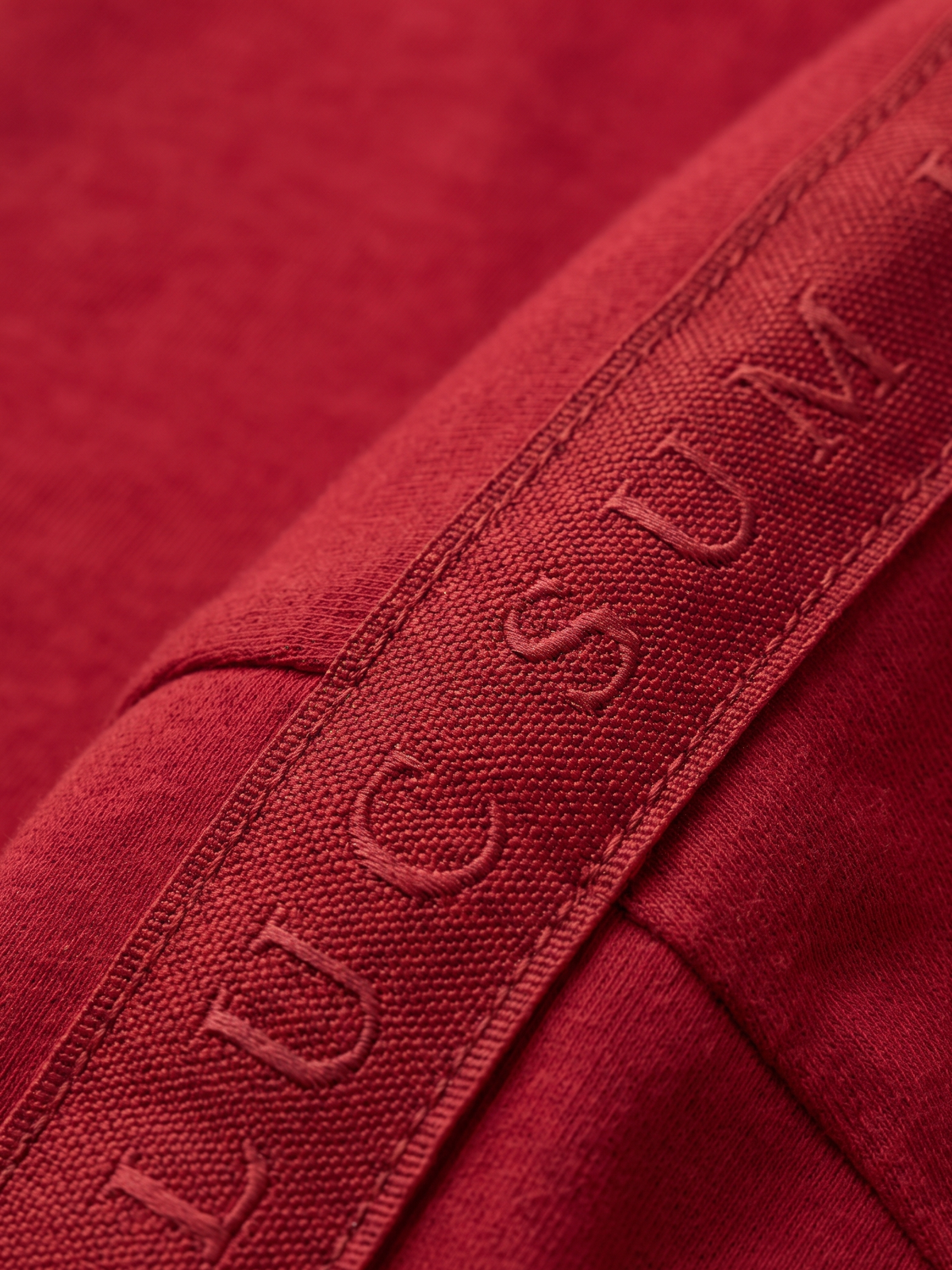 Lucsum Branded Tape Red — Macro close-up