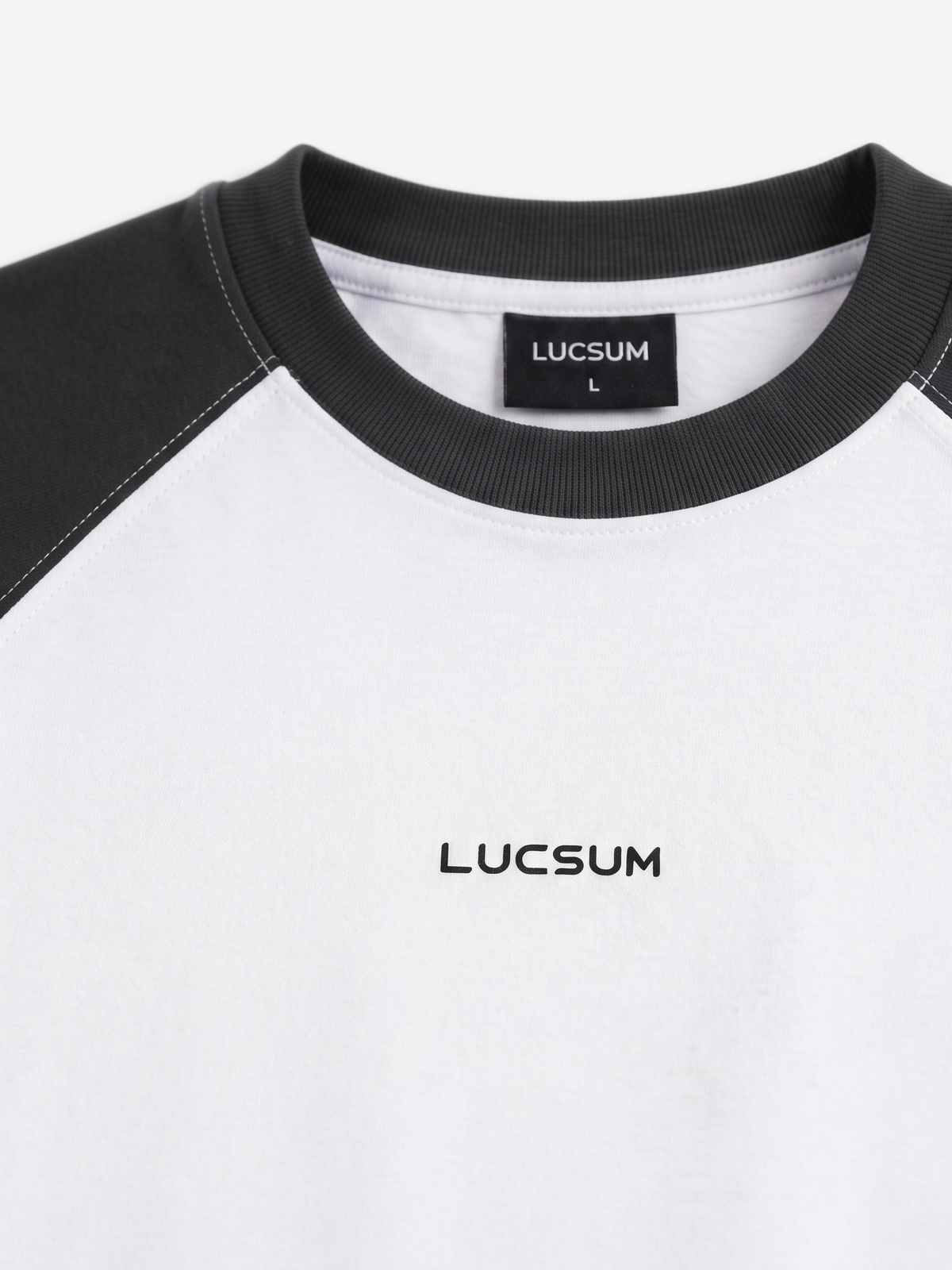 Lucsum Raglan Baseball Black/White oversized tee, macro raglan seam and collar detail