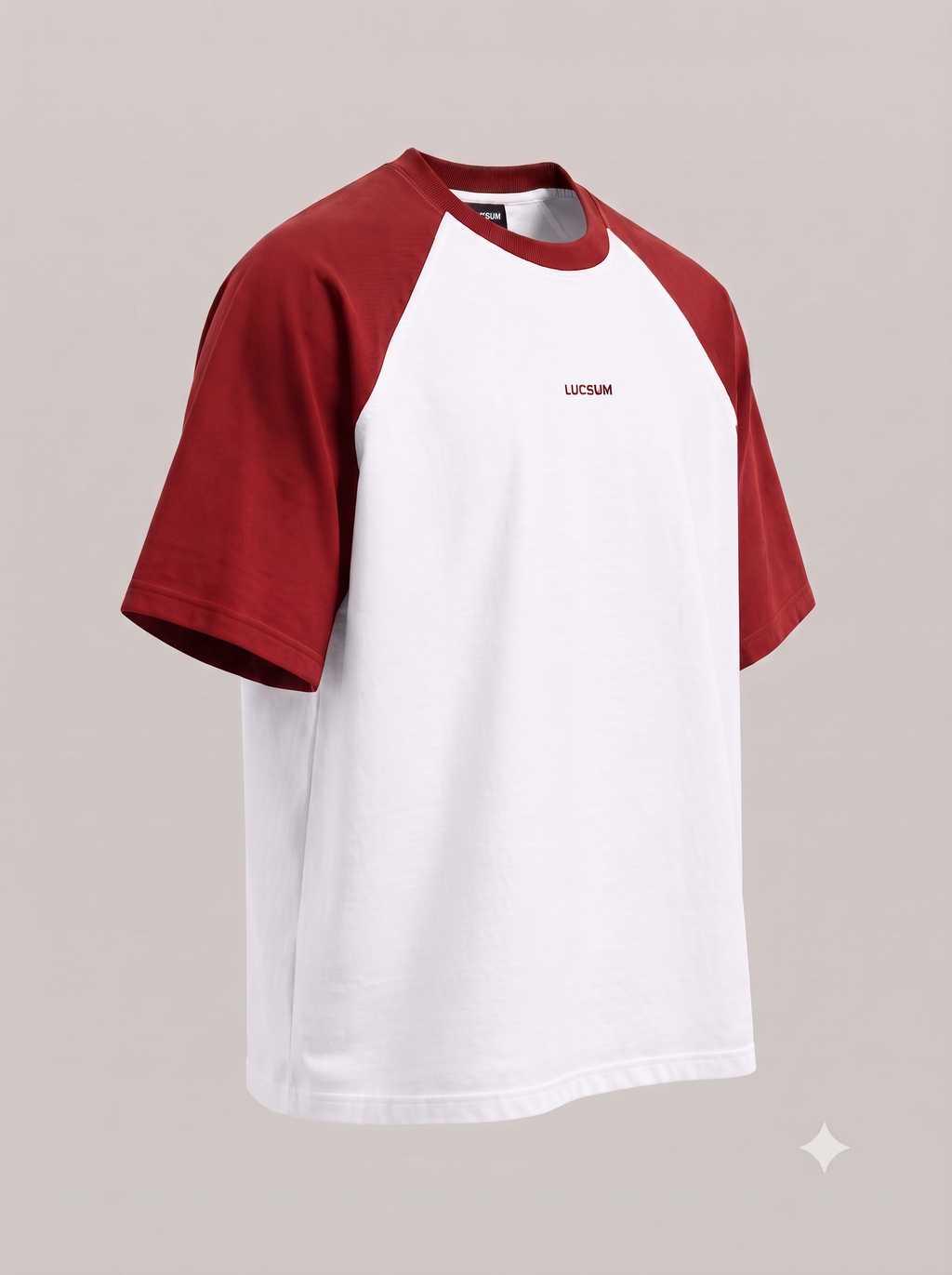 Lucsum Raglan white oversized tee with maroon sleeves and collar and a red LUCSUM wordmark, three-quarter view